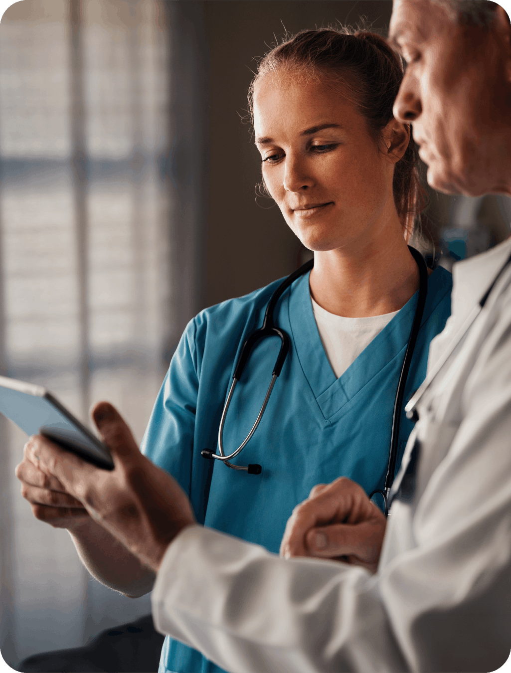Physician signing a report